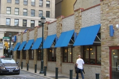 Multiple Blue Store Window Awnings