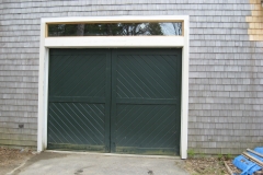 One Dark Green Garage Door